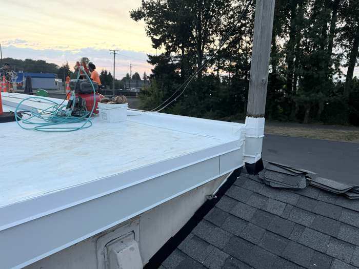 Close-up of a commercial roof repair in progress